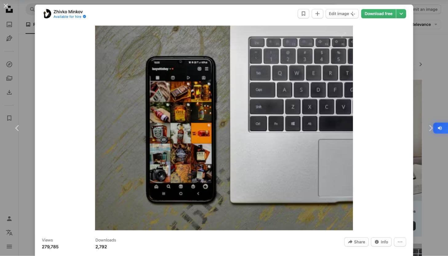 Instagram photo grid on smartphone next to laptop - how to download photos from social media